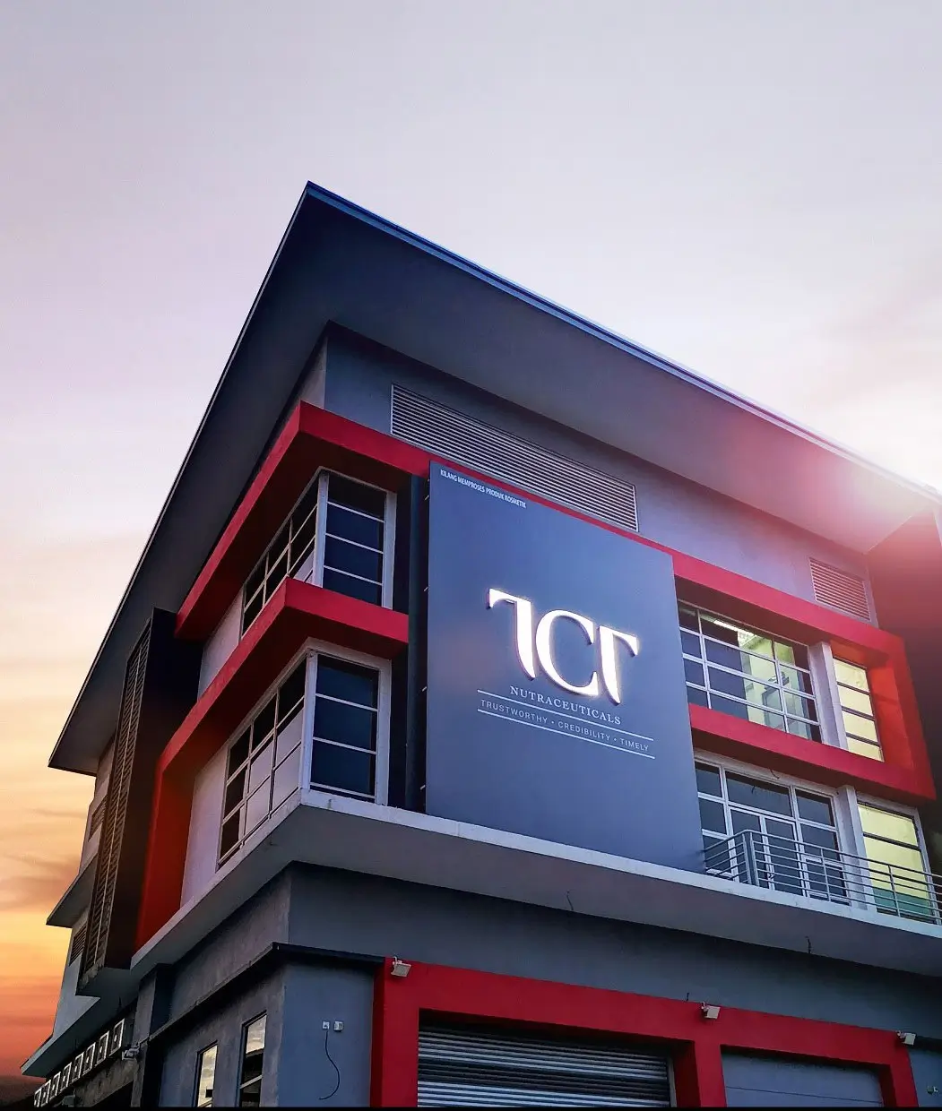TCT company facility with red exterior panels and central signage